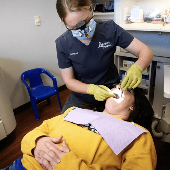 Dr Preston working on patient's teeth